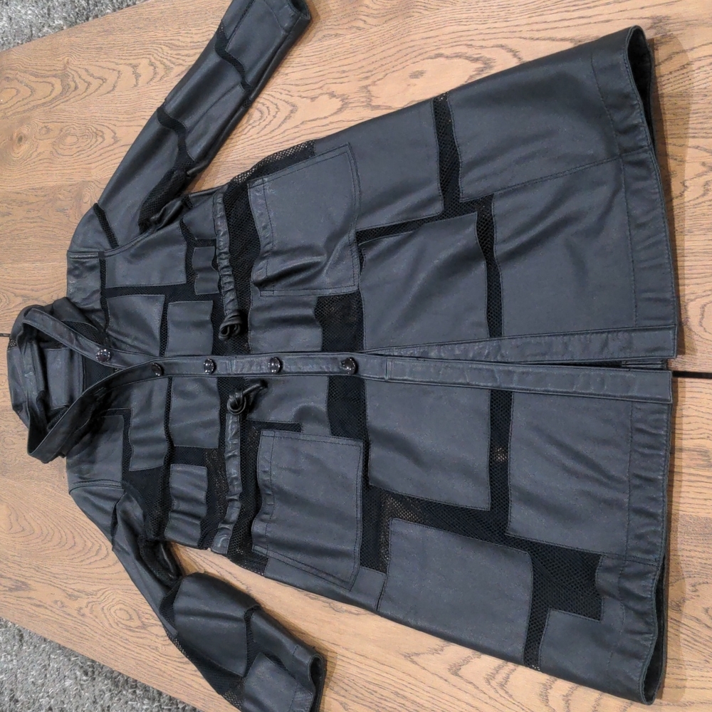 Never worn retro long leather coat with mesh accents and hoodie. Very Soft!